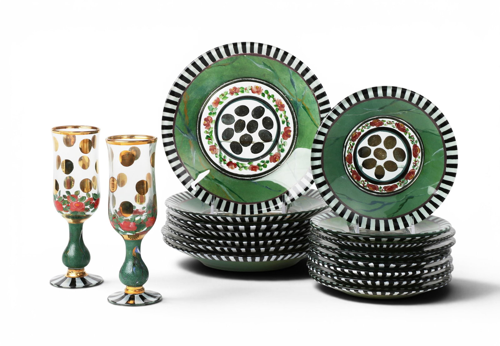 A seventeen piece collection of Mackenzie-Childs Circus Rose reverse painted clear glassware, circa: A seventeen piece collection of Mackenzie-Childs Circus Rose reverse painted clear glassware circa 1993 Comprising seven 9in (23cm) plates, eight 7in (20.5cm) side plates, and a pair of 7 3/4in (19.5c