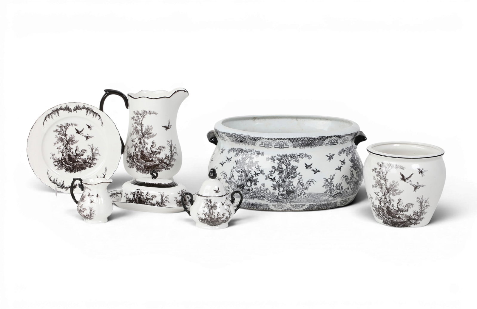 A group of seven black painted porcelain table articles: A group of seven black painted porcelain table articles Planter: height 7 x width 15 x depth 11 in. (17.8 x 38.1 x 27.9 cm.)