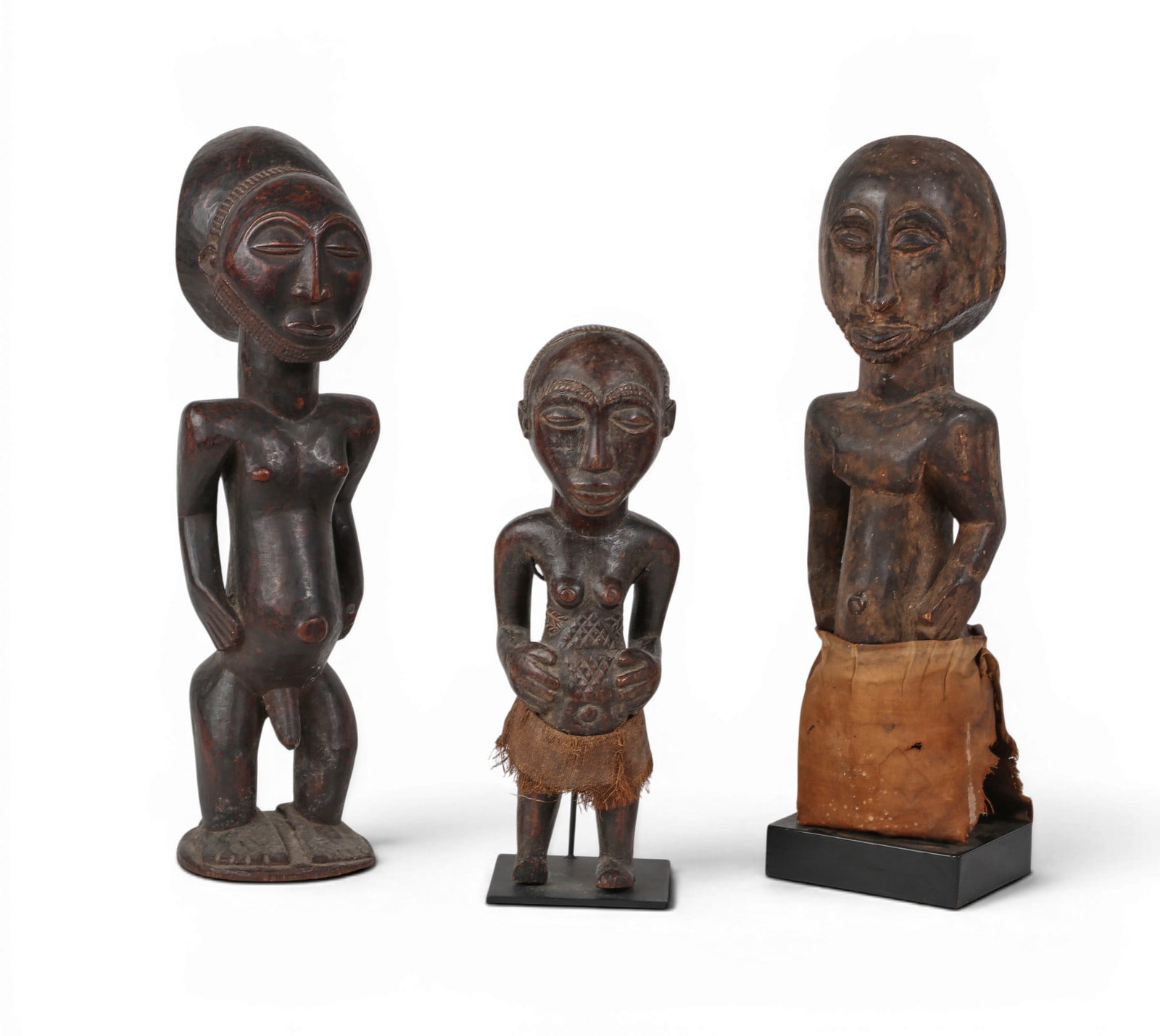 A grouping of three Congolese singiti ancestral figures (1 of 4)