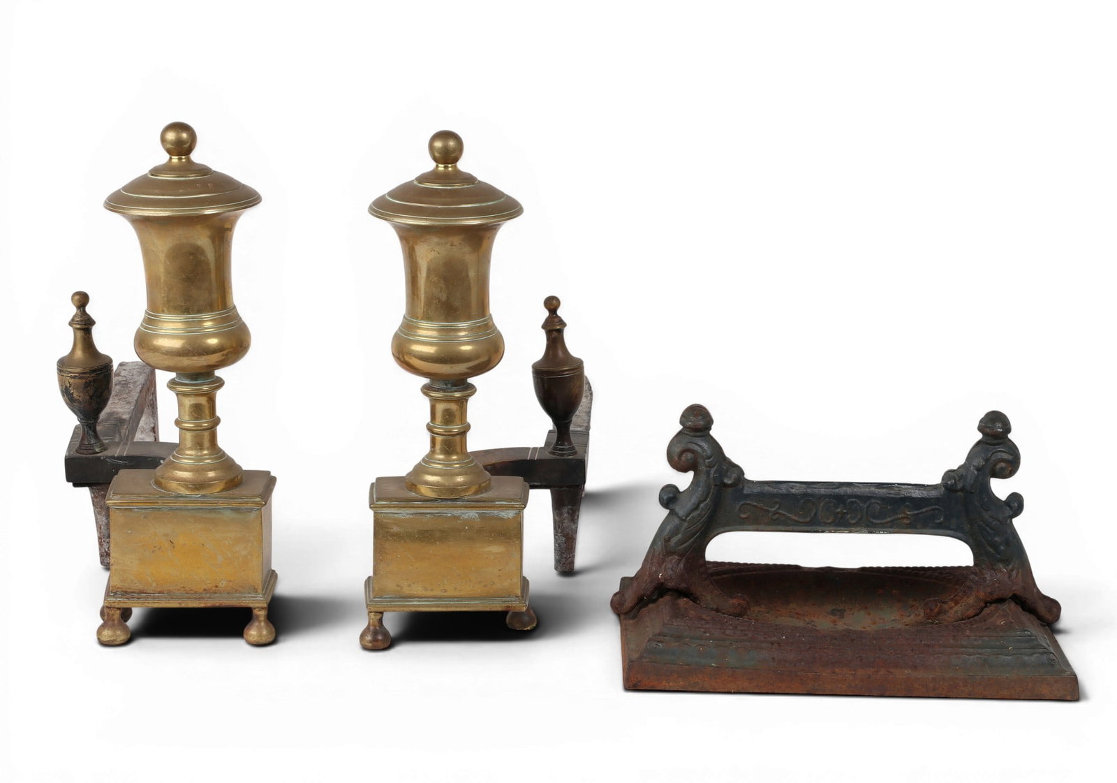 A pair of andirons together with a shoe brush (1 of 3)
