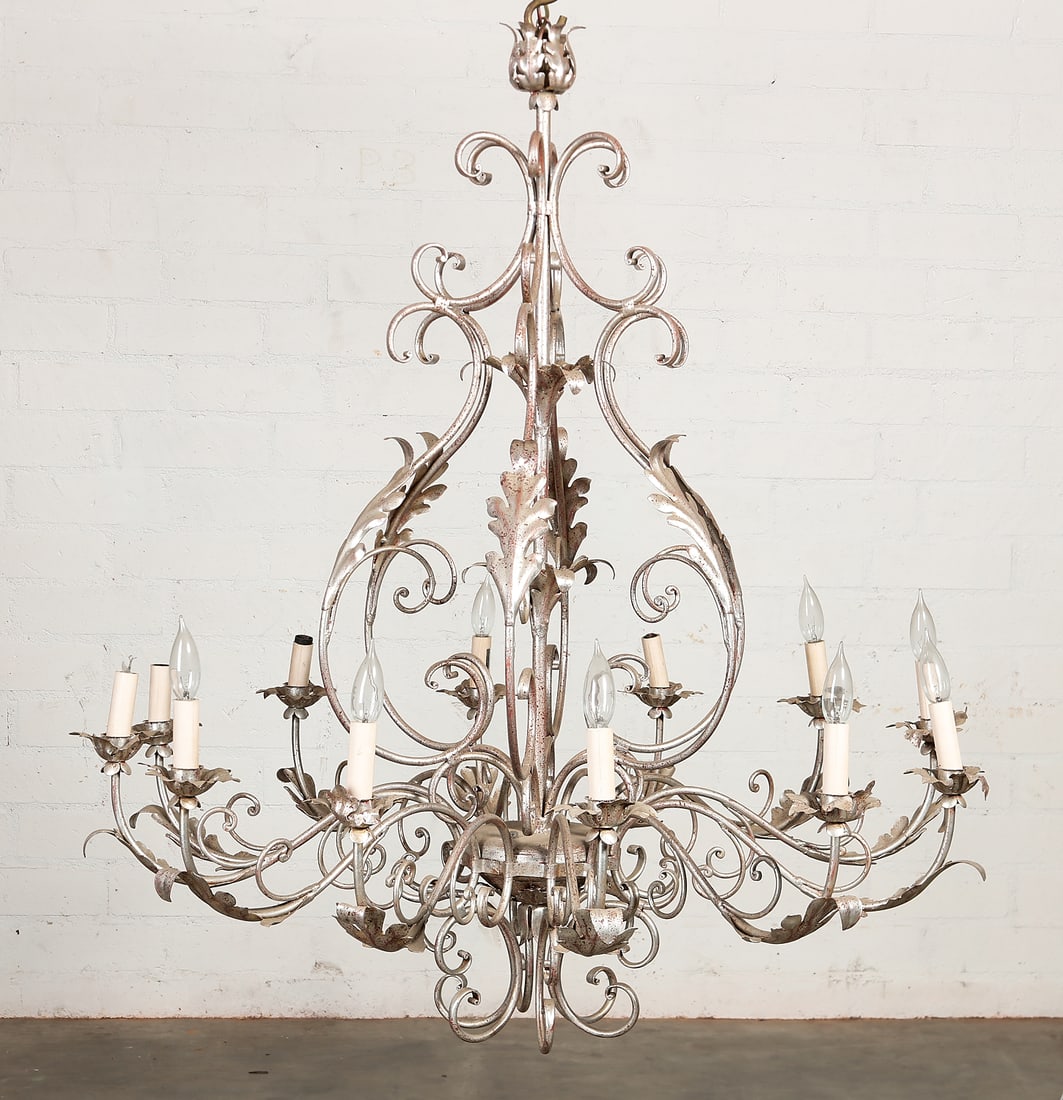 A Baroque style silvered metal twelve light chandelier, post 1950: A Baroque style silvered metal twelve light chandelier post 1950 height 44 1/2in (113cm); diameter 39in (99cm) Provenance: Property from the Estate of Keith McCoy, Los Angeles, California.