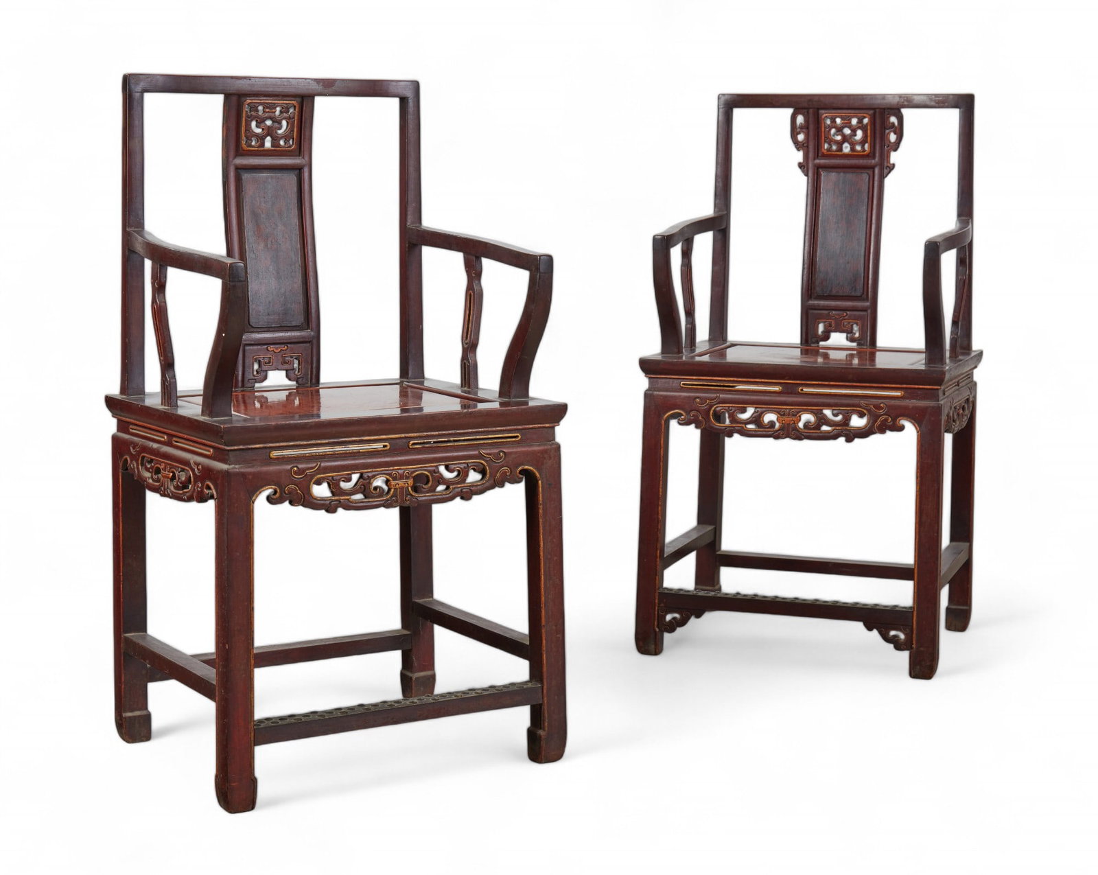 A pair of Chinese elmwood and parcel gilt armchairs: A pair of Chinese elmwood and parcel gilt armchairs height 40 1/4in (100.5cm); width 21 1/2in (54cm); depth of seat 16 1/2in (41cm)
