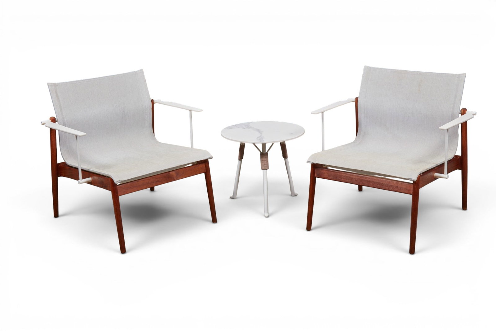 A pair of outdoor lounge chairs with associated side table by Gloster (1 of 9)