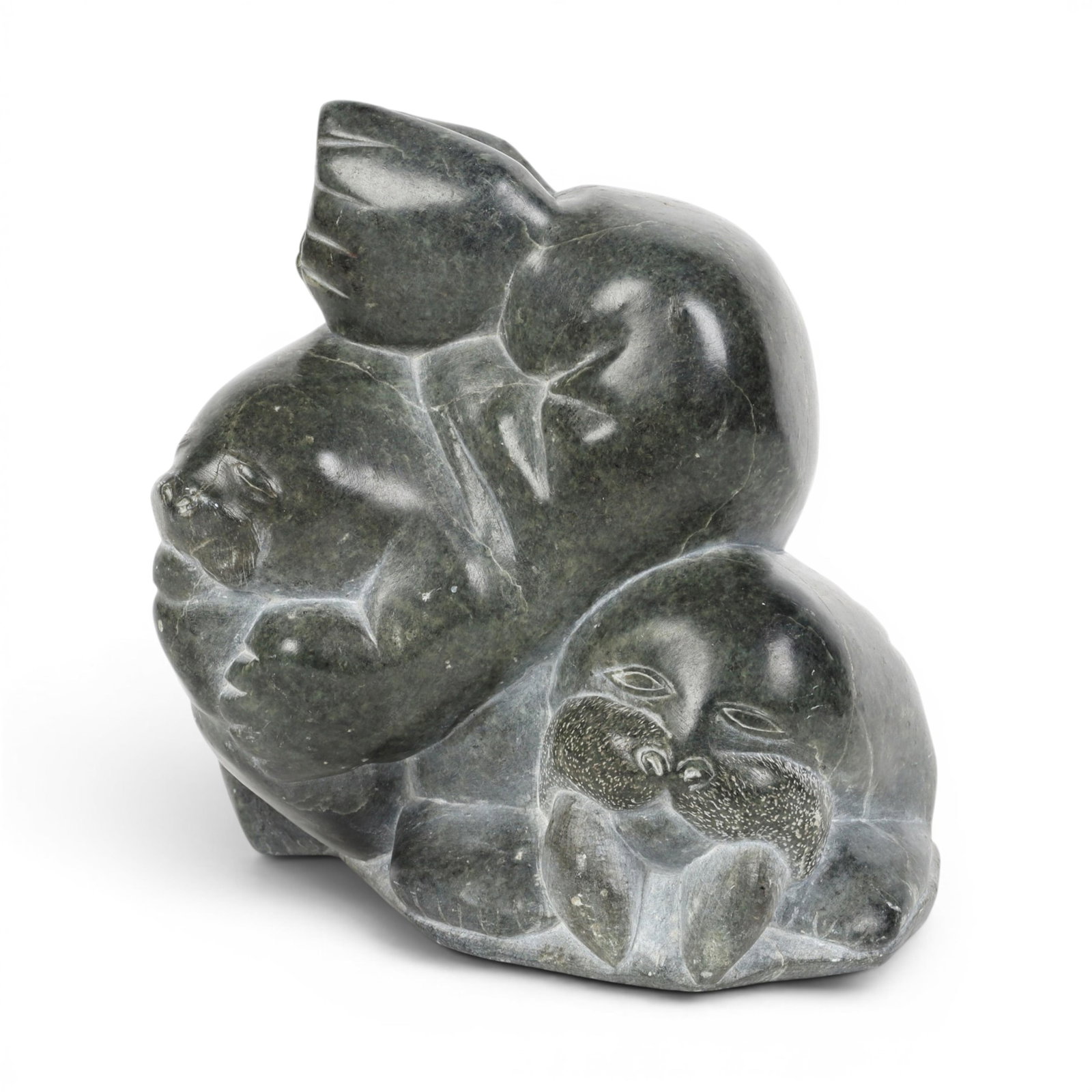 An Eskimo stone carving: An Eskimo stone carving height 9 1/2in (24cm); width 10in (25.5cm); depth 7in (18cm) Provenance: Property from the collection of Frederick M Nicholas, Beverly Hills, California.