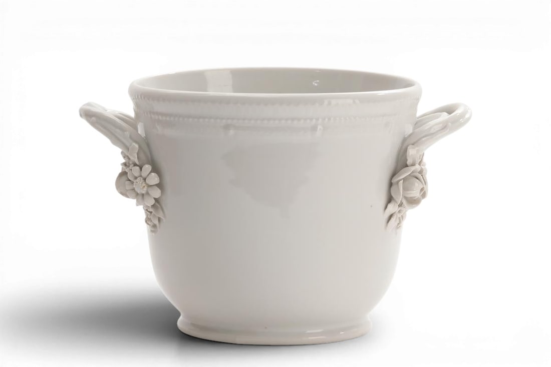 A Royal Copenhagen blanc de chine porcelain cache pot date code for 1946: A Royal Copenhagen blanc de chine porcelain cache pot date code for 1946 Green painted factory mark above blue wave mark incised 3571 T. height 6 1/2in (16.5cm); width across handles 10 1/4in (26cm)