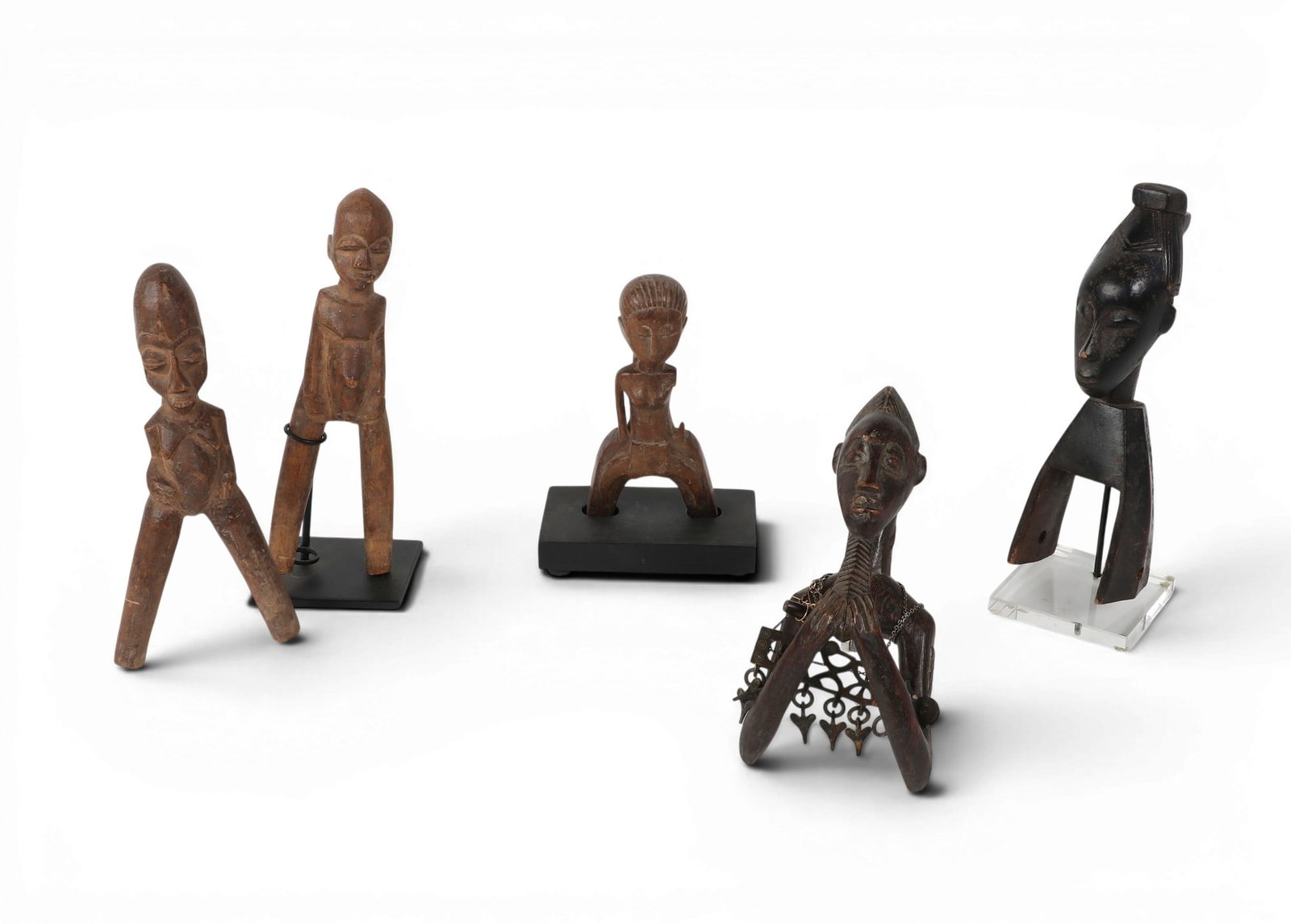 A group of five Baule-style ancestral figures, Ivory Coast: A group of five Baule-style ancestral figures, Ivory Coast lot includes five Baule female carved wooden ancestral figures. largest 9 1/2 x 3 x 3in (24 x 8 x 8cm)