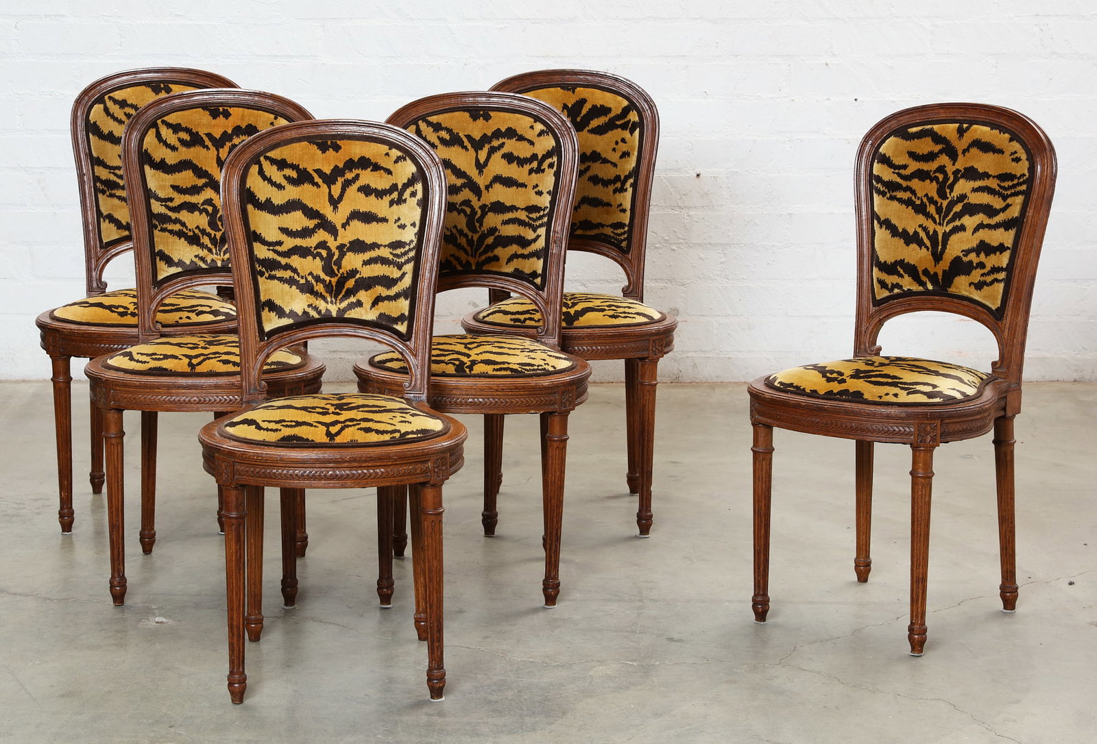 A set of six Louis XVI style oak side chairs, early 20th century: A set of six Louis XVI style oak side chairs early 20th century (6) height 37 1/2in (95cm); width 18 1/2in (47cm); depth of seat 16 1/2in (42cm)