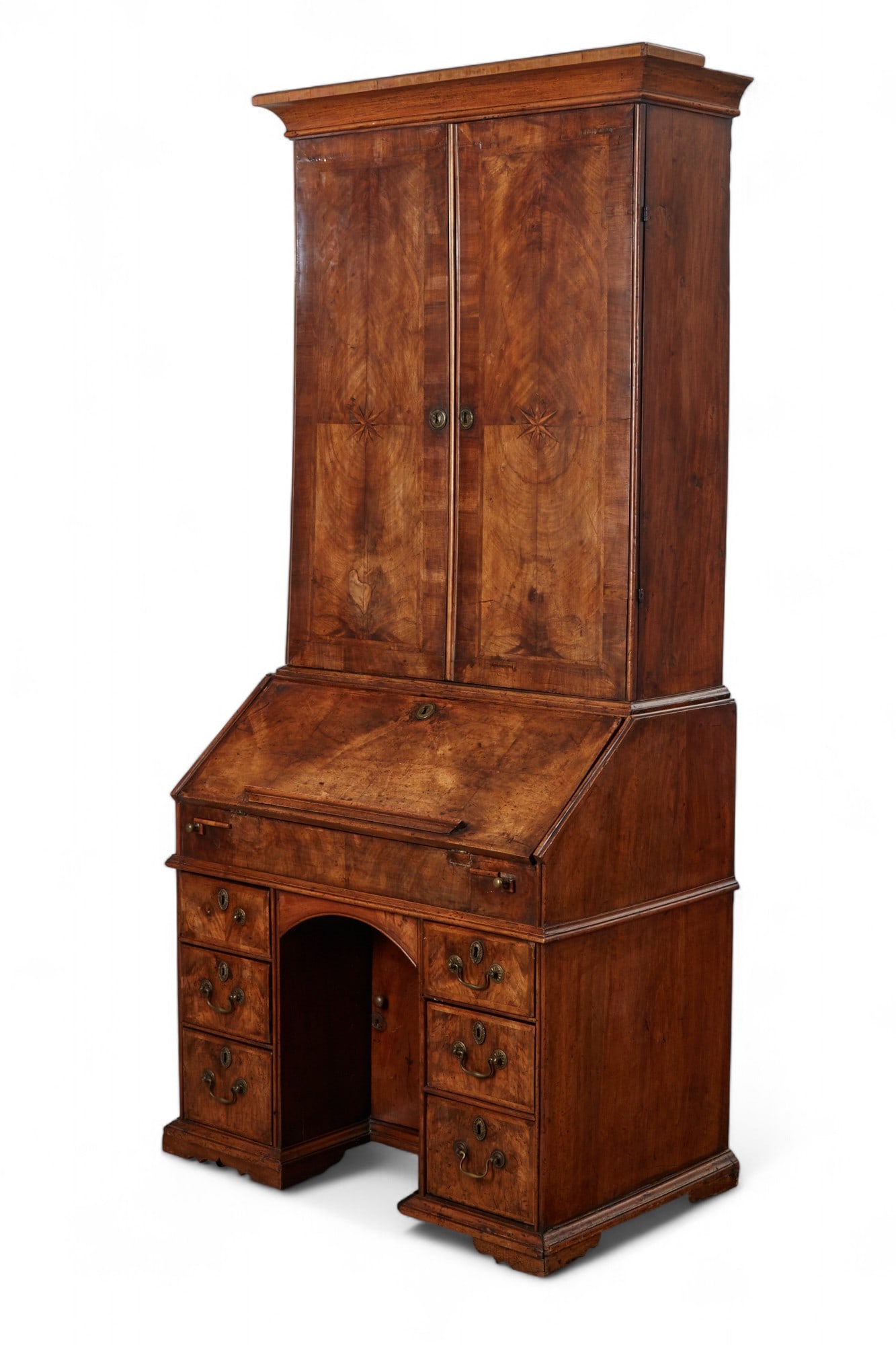 A George I walnut and parquetry bureau cabinet, early 18th century: A George I walnut and parquetry bureau cabinet early 18th century The upper section with a pair of doors opening to an arrangement of shelves and drawers centered by a door at the base above a fall fr