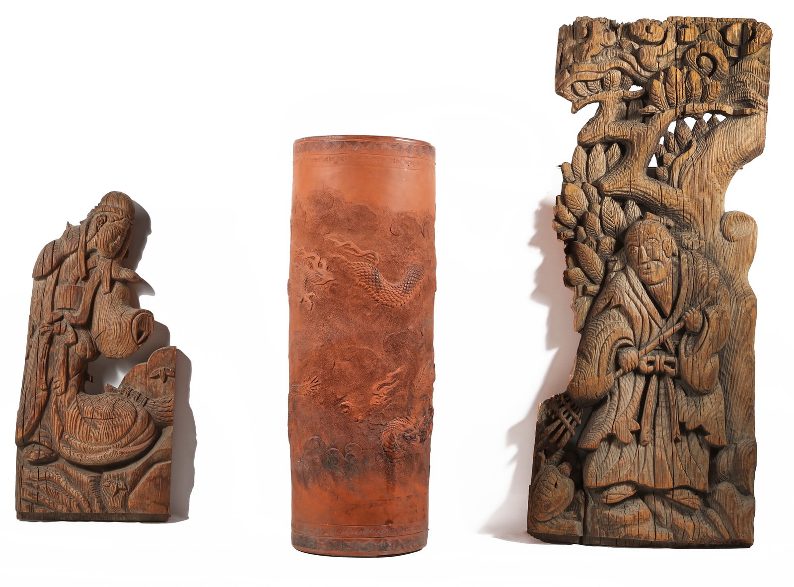 Three Japanese articles: Three Japanese articles Comprising a red clay circular vessel and two wooden fragments. (3) height 24in (61cm) 34in (87cm)
