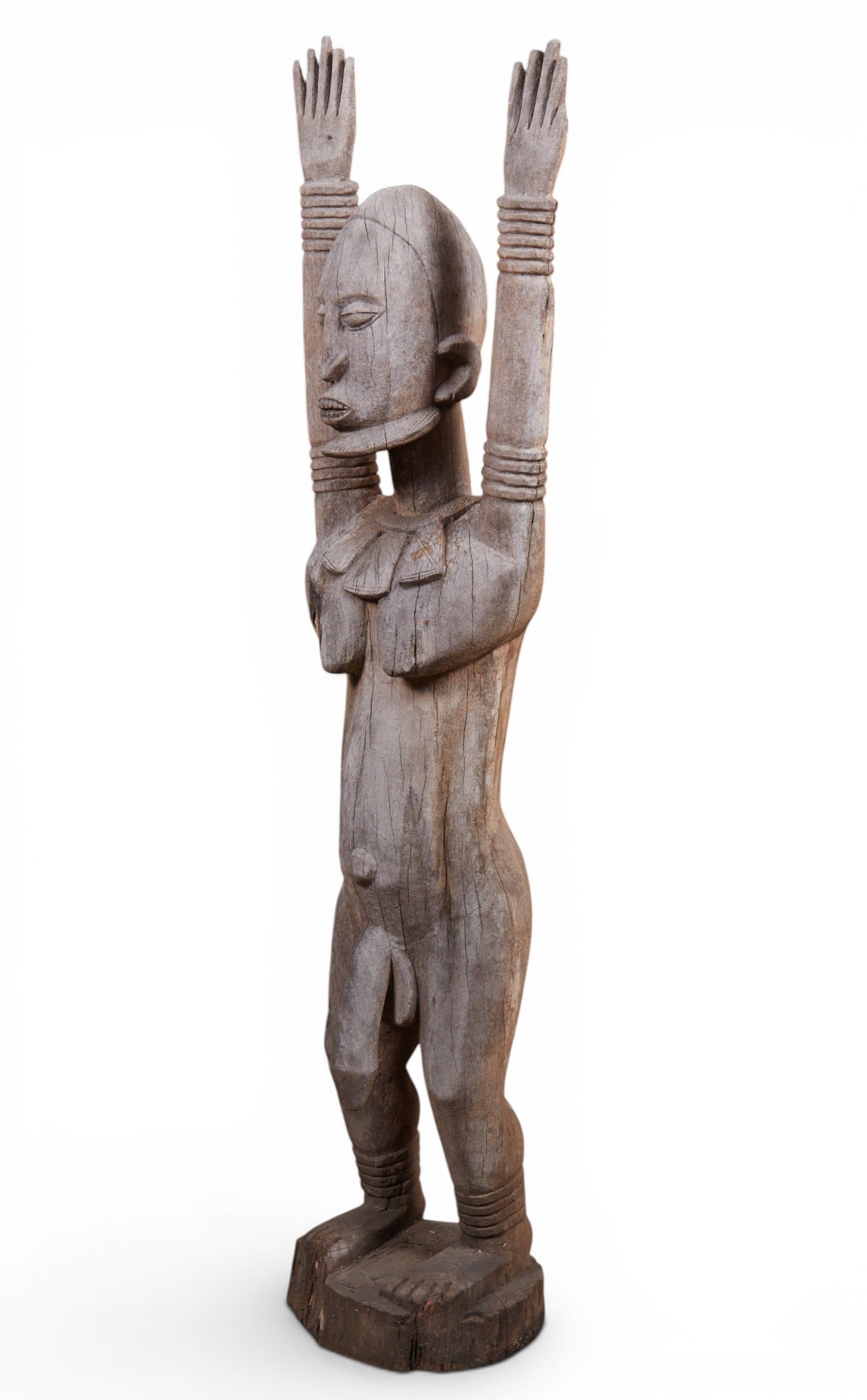 An imposing standing male ancestral harvest and fertility guardian figure, probably Mali: An imposing standing male ancestral harvest and fertility guardian figure probably Mali 20th century height 70in (178cm); width 16in (41cm); depth 12in (33cm)