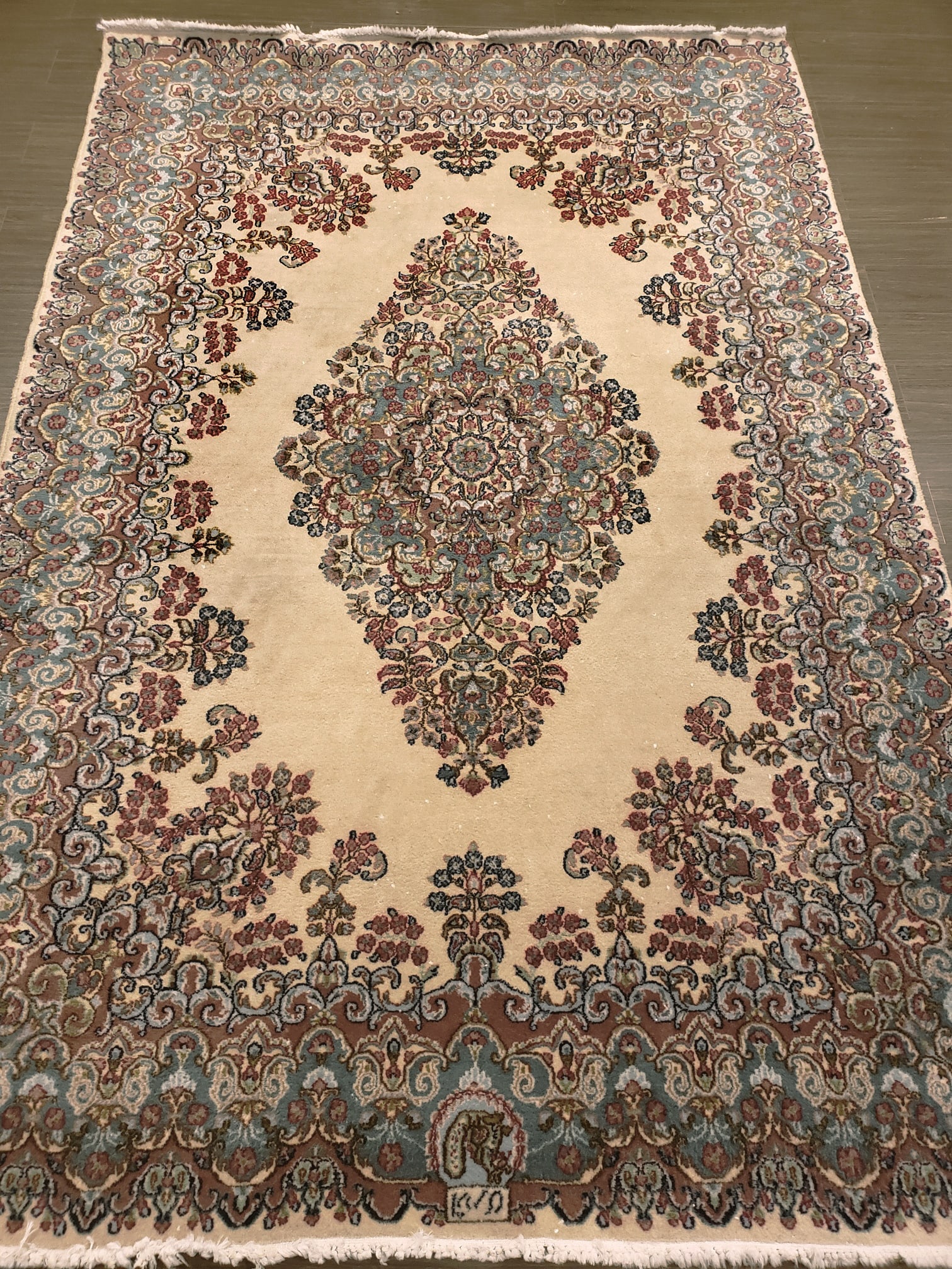 A signed Kerman area rug - 9
