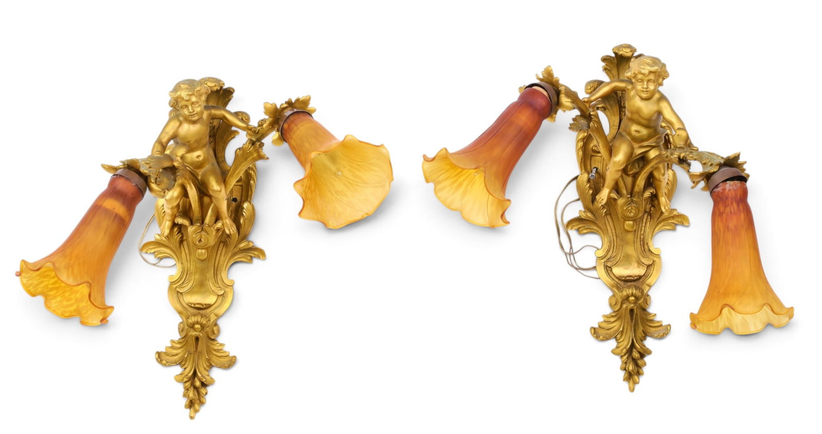 A pair of figural gilt bronze two light wall sconces with amber colored ruffled glass shades., (1 of 5)