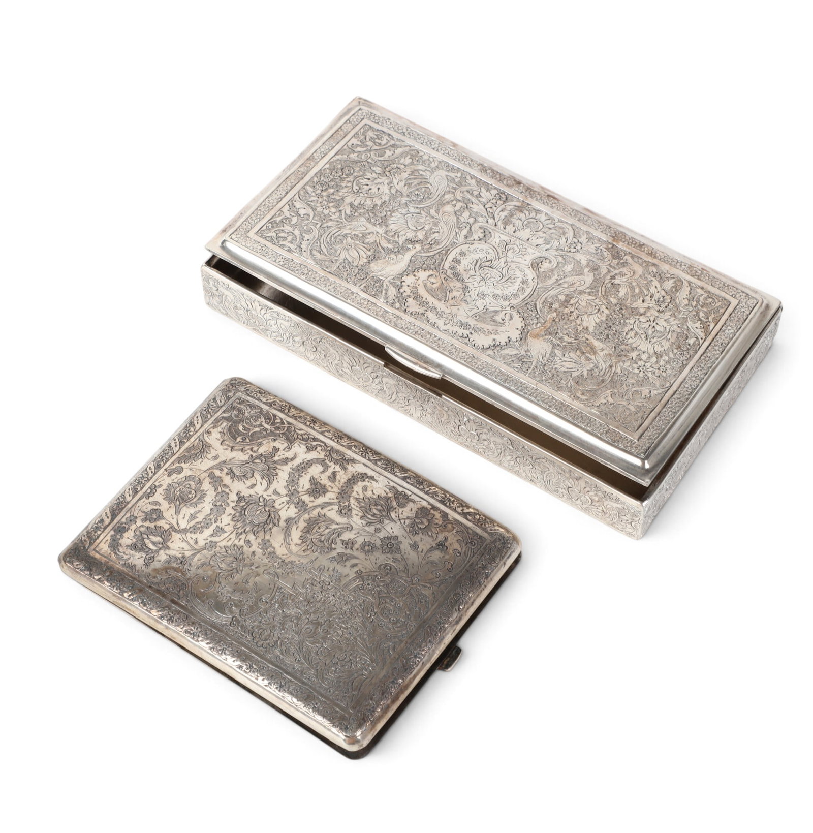 A sterling silver Persian table box and a cigarette case: A sterling silver Persian table box and a cigarette case 14.50t oz (451g)Largest box: height 1 x width 6 x depth 3 in. (2.5 x 15.2 x 7.6 cm.)
