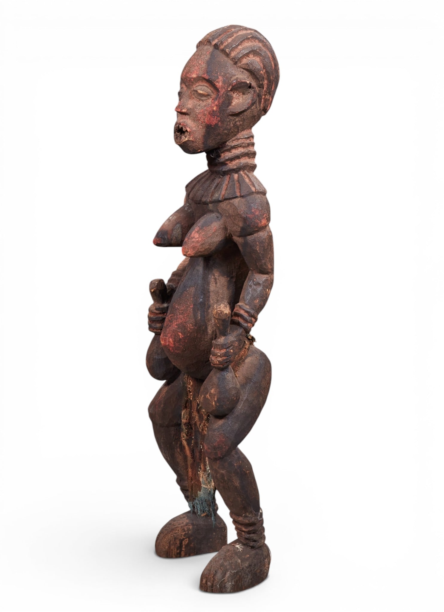 A large African standing female ancestral harvest and fertility guardian figure, probably Yoruba, (1 of 7)