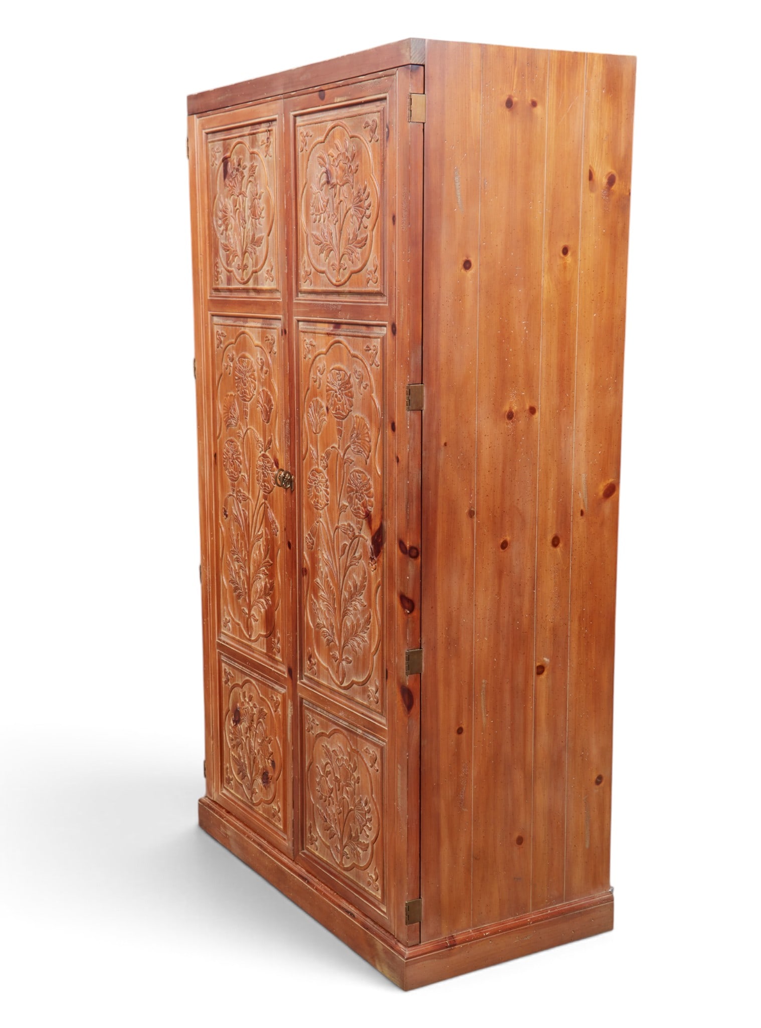 A large two door cabinet with intricare hand carved floral and leaf design.: A large two door cabinet with intricare hand carved floral and leaf design. height 77 x width 41 x depth 22 in. (195.6 x 104.1 x 55.9 cm.)
