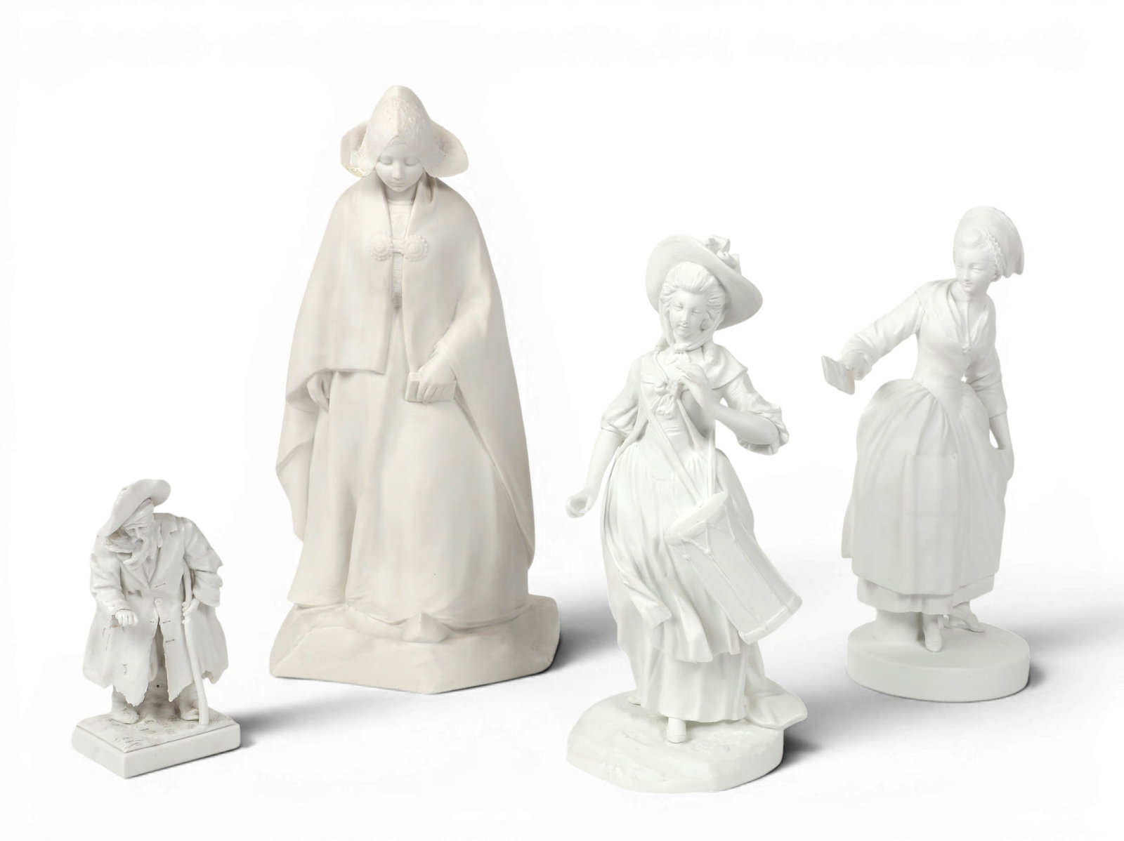 Four bisque porcelain figures, Sevres and other maker, late 19th/early 20th century: Four bisque porcelain figures Sevres and other maker late 19th/early 20th century Comprising three Sevres figures including a model of a beggar, a Provincial woman with envelope in hand, and a woman i
