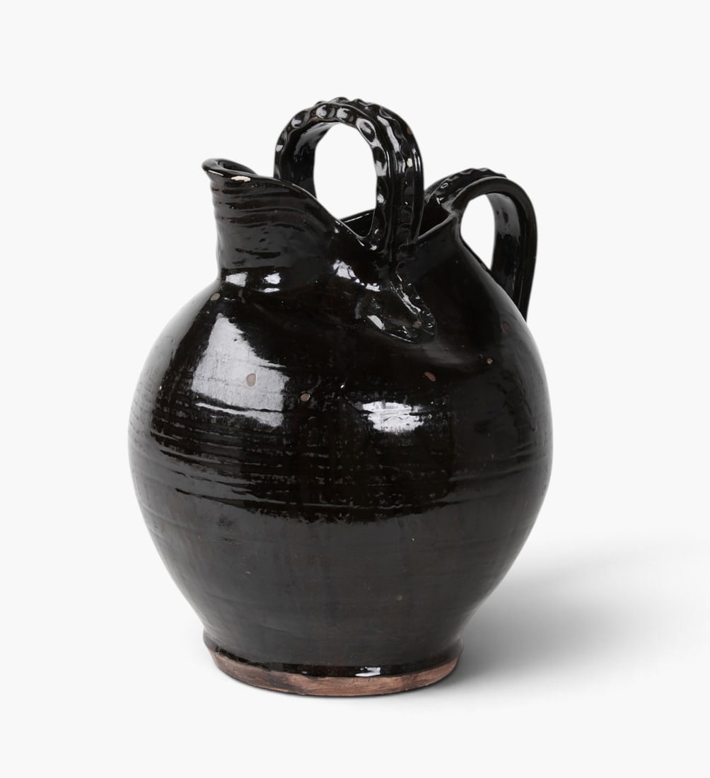 A Continental black glazed earthenware jug (1 of 7)