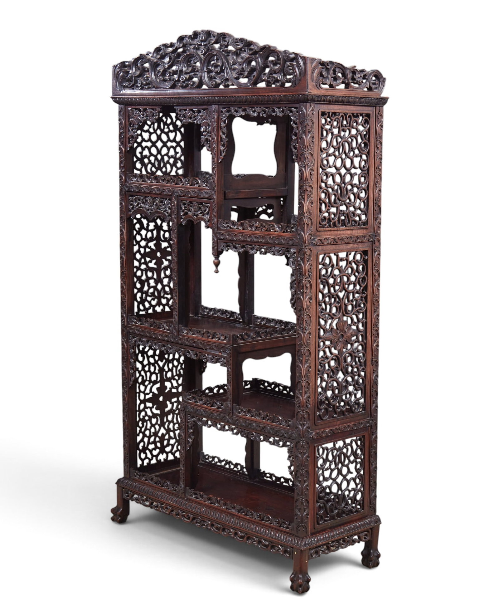 A Chinese carved etagere with intricate openwork pierced carving., possibly 19th century.: A Chinese carved etagere with intricate openwork pierced carving. possibly 19th century. height 72 x width 42 x depth 16 in. (182.9 x 106.7 x 40.6 cm.)