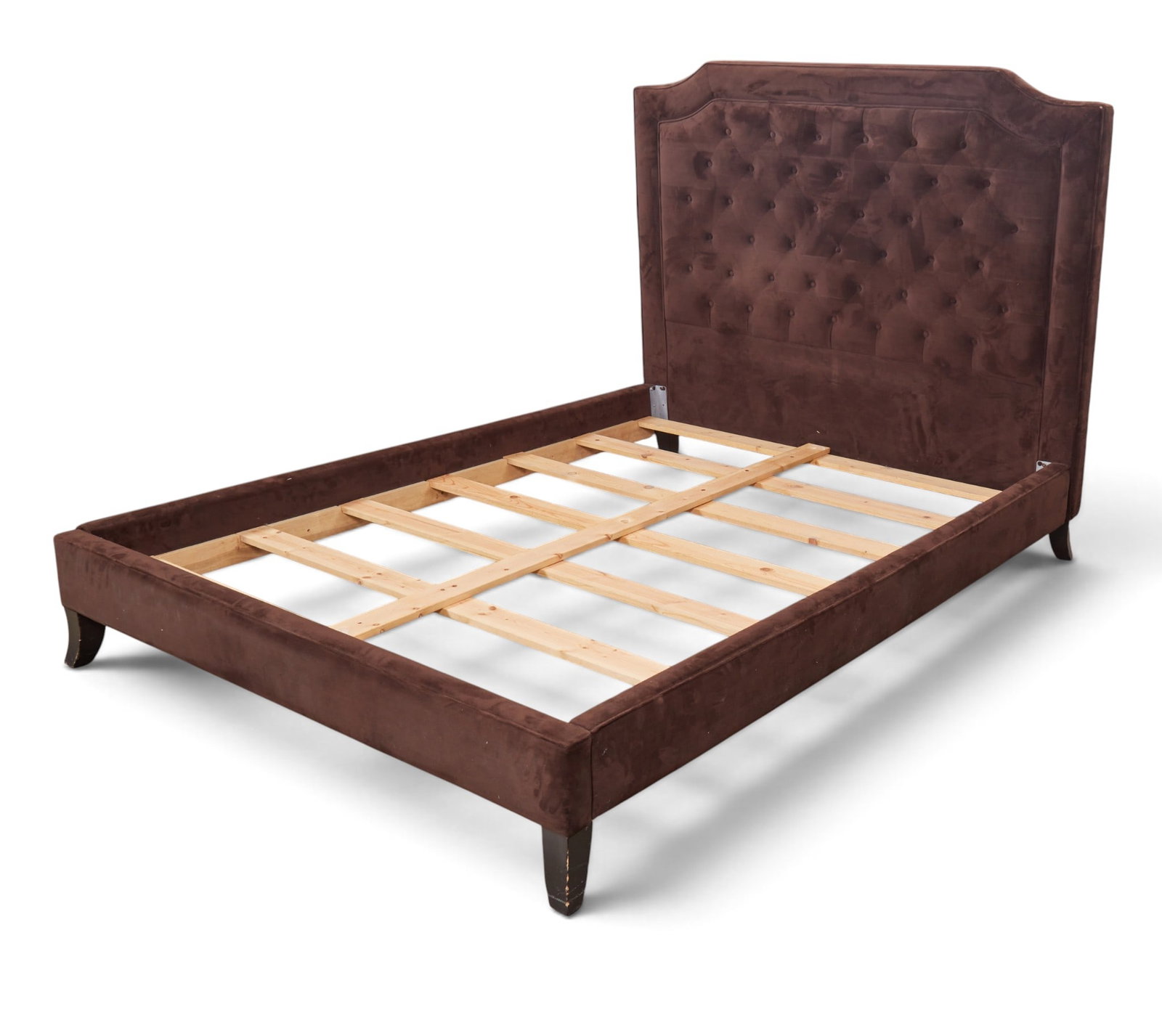 A queen size upholstered bed: A queen size upholstered bed height 56 in. (142.2 cm.)