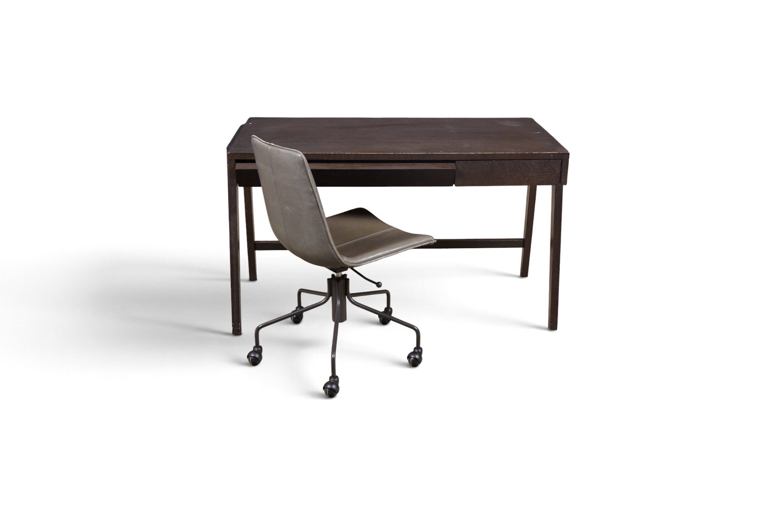 A contemporary office desk and chair: A contemporary office desk and chair Table: height 30 x width 53 x depth 26 1/4 in. (76.2 x 134.6 x 66.7 cm.)