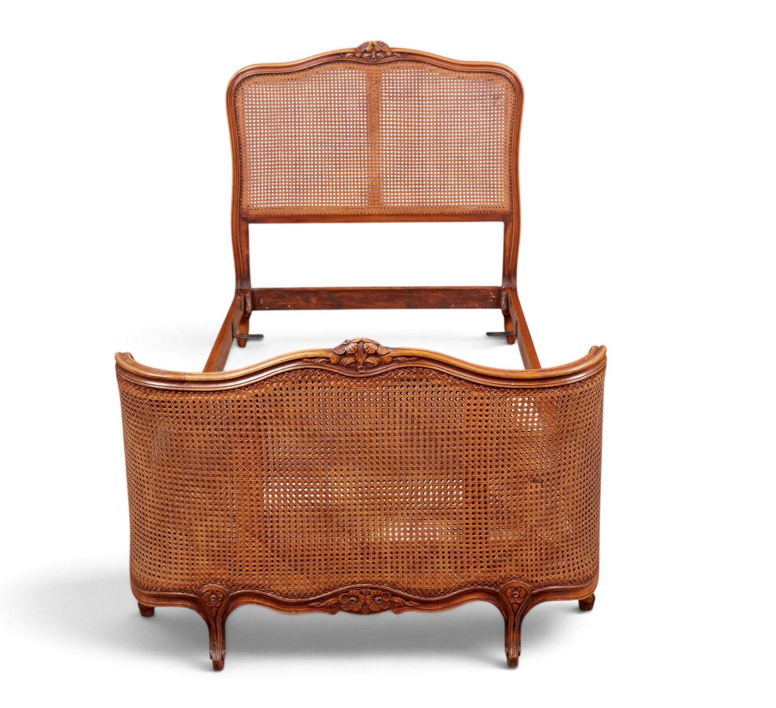 A cane back bed - 2