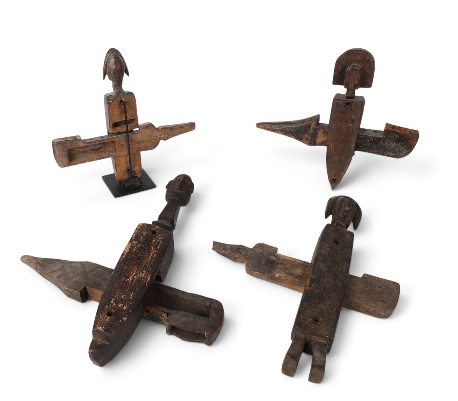 Four West/Central African patinated carved wood figural granary door locks (1 of 8)