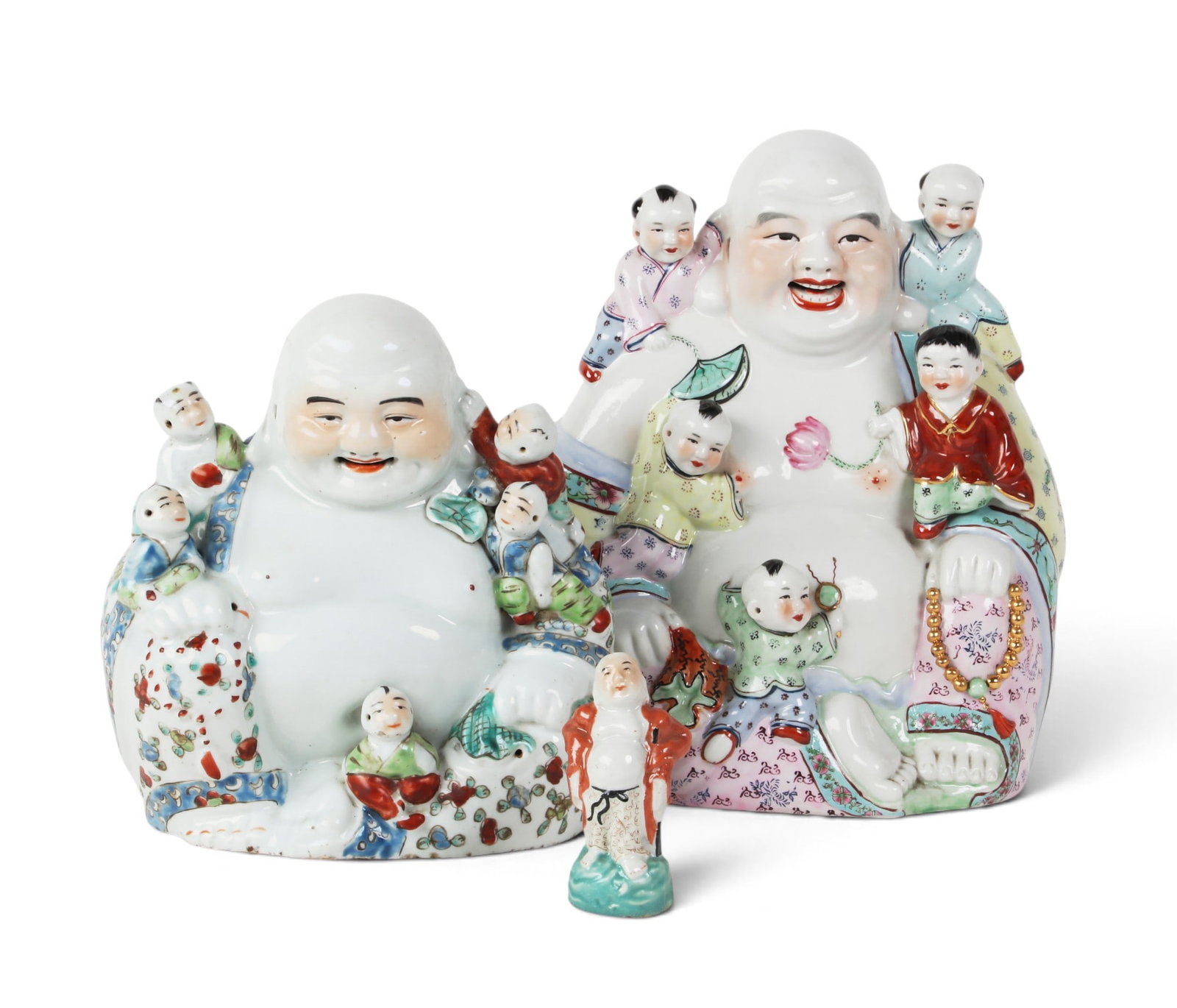 A group of two Chinese porcelain laughing buddha together with a standing figure. (1 of 6)
