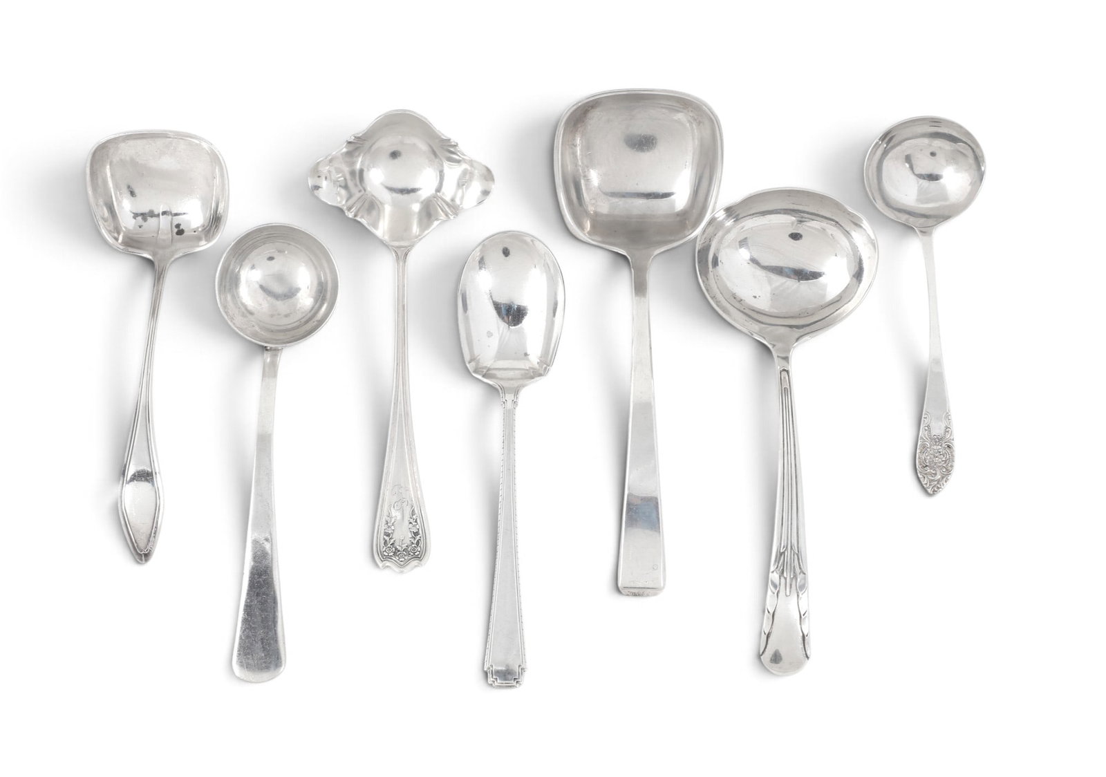 A group of seven assorted sterling silver ladles: A group of seven assorted sterling silver ladles 9.066t oz (282g)