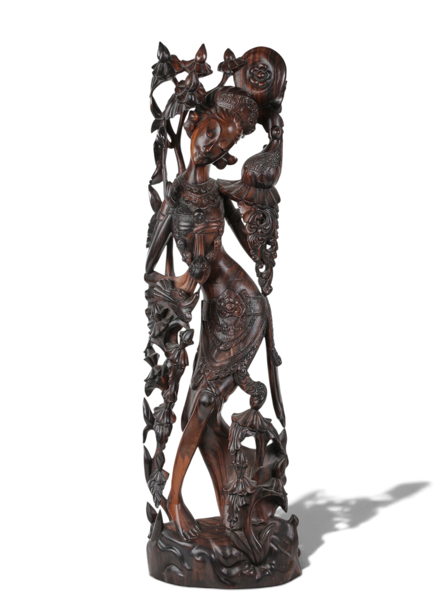 A large Asian wood carving: A large Asian wood carving height 36 x width 11 x depth 5 in. (91.4 x 27.9 x 12.7 cm.)