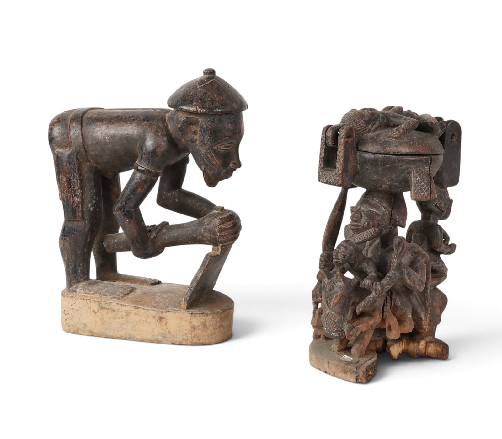 Two West/Central African sculptural figures: Two West/Central African sculptural figures lot includes a complex Ujamaa (family tree of life), Makonde style moveable and painted carving largest: 19 x 15 x 8in (48 x 38 x 20cm)