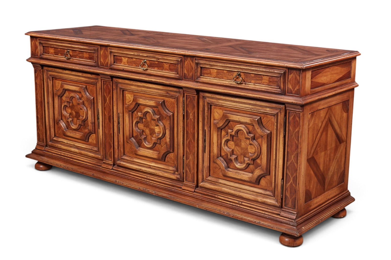 A sideboard with carved cabinet doors.: A sideboard with carved cabinet doors. height 38 x width 84 x depth 26 in. (96.5 x 213.4 x 66 cm.)