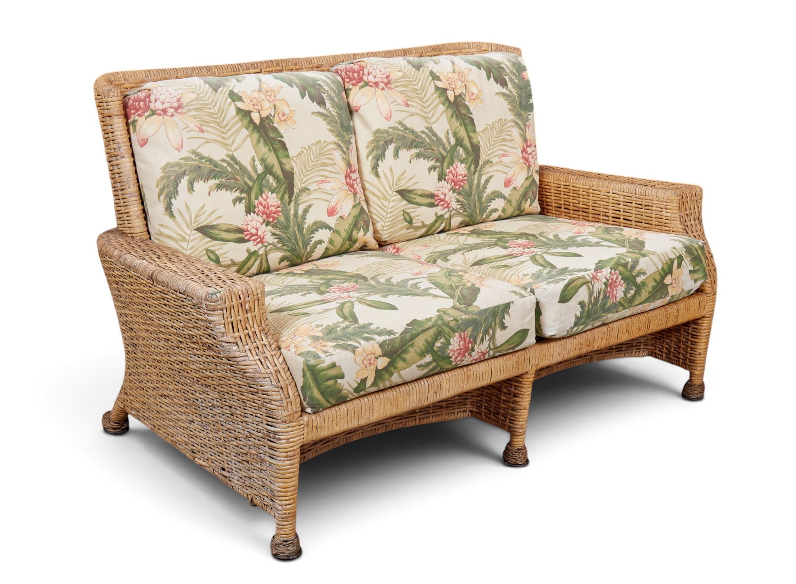 A vintage wicker rattan loveseat with tropical floral fabric cushions. (1 of 5)