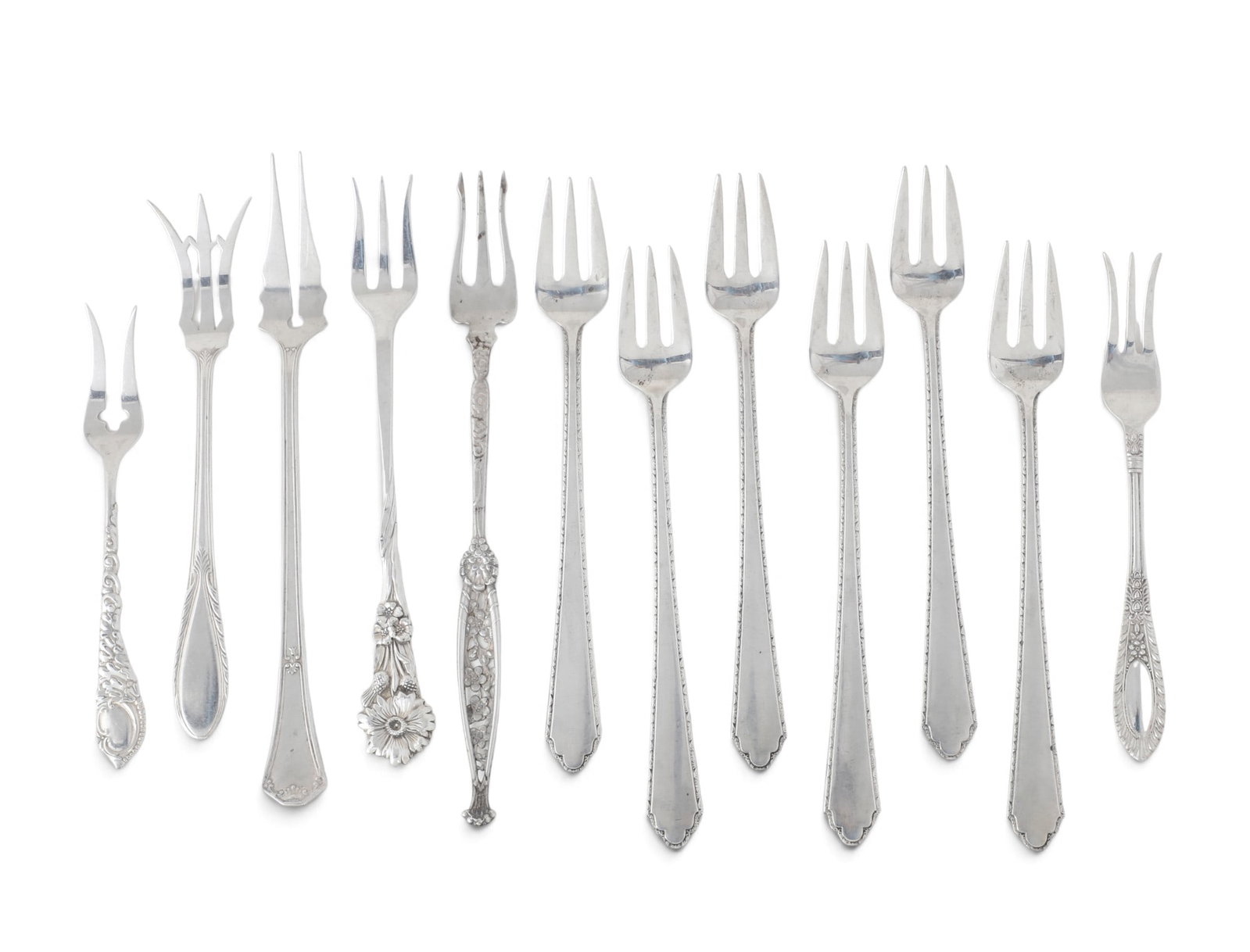 A group of twelve sterling silver cocktail and pickle forks: A group of twelve sterling silver cocktail and pickle forks 5.884t oz (183g)