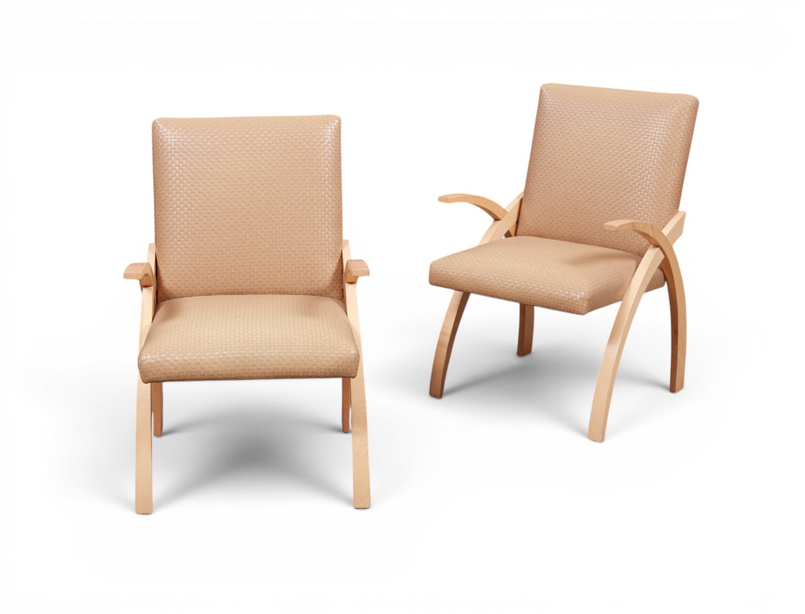 A pair of Modernist blonde wood armchairs: A pair of Modernist blonde wood armchairs height 36 1/2in (92.5cm); width 23 1/2in (59.5cm); depth of seat 18in (45.5cm)