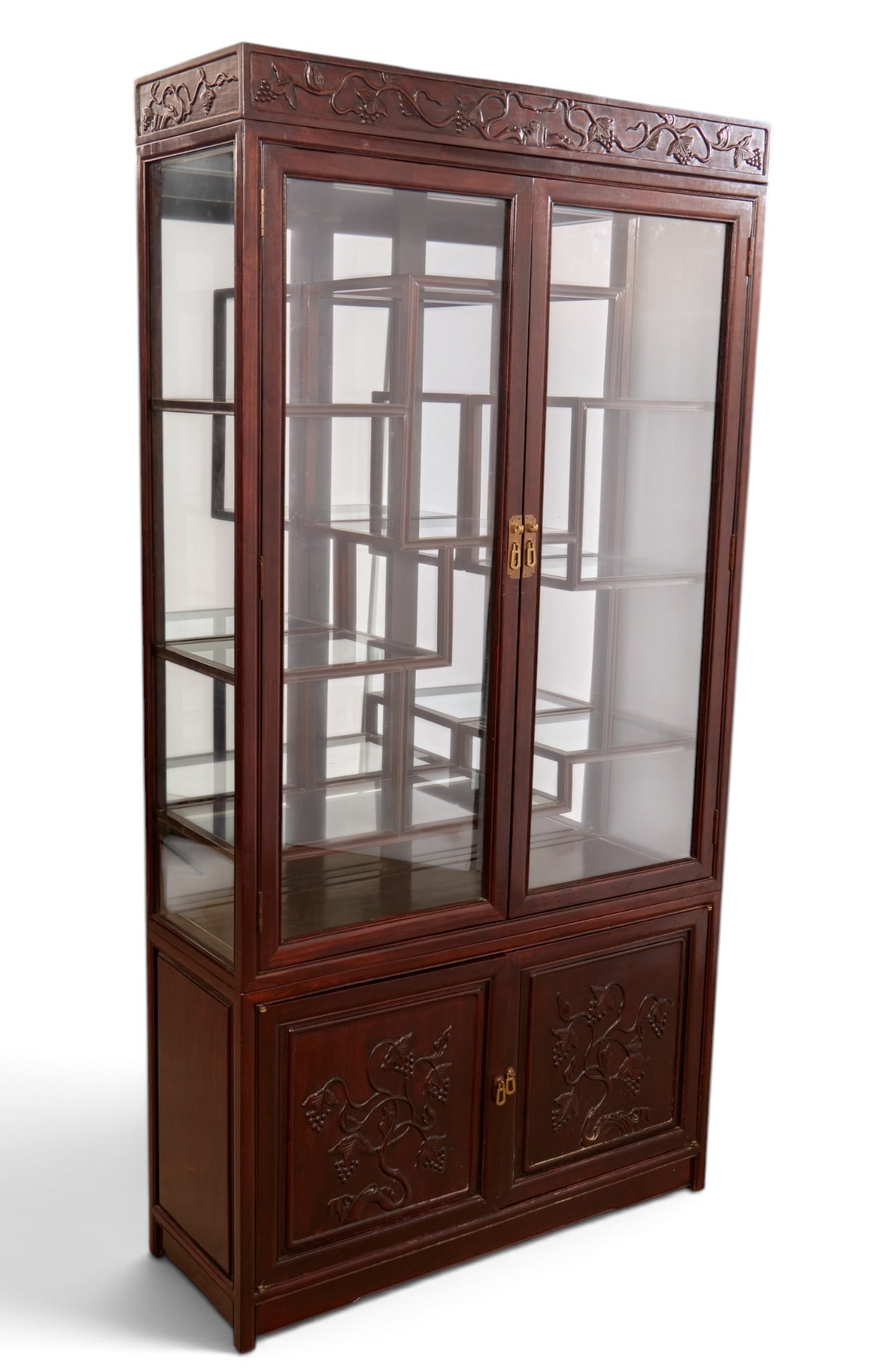 A Chinese two door display cabinet with glass upper doors: A Chinese two door display cabinet with glass upper doors height 79 x width 40 x depth 14 in. (200.7 x 101.6 x 35.6 cm.)