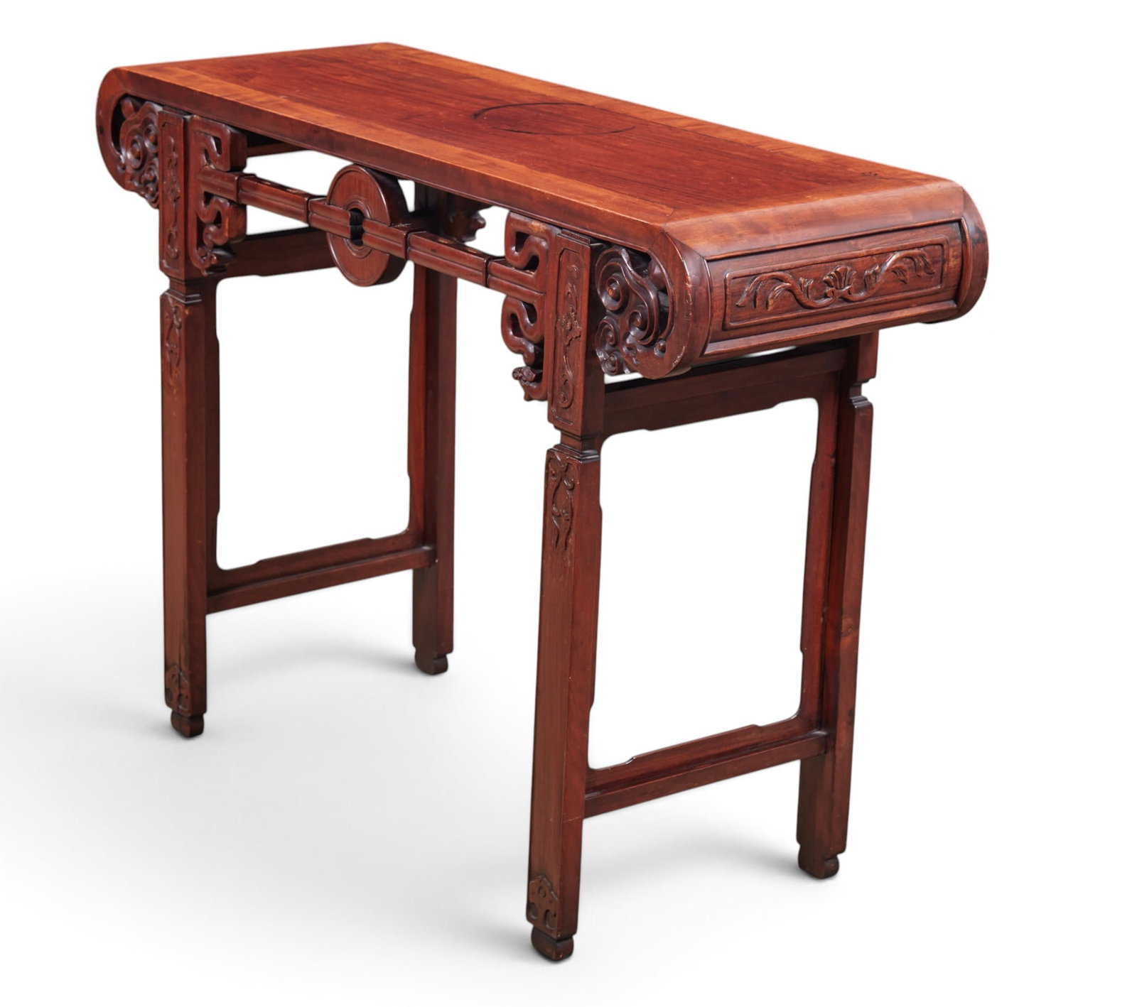 A Chinese carved alter table: A Chinese carved alter table height 33 x width 45 x depth 16 in. (83.8 x 114.3 x 40.6 cm.)