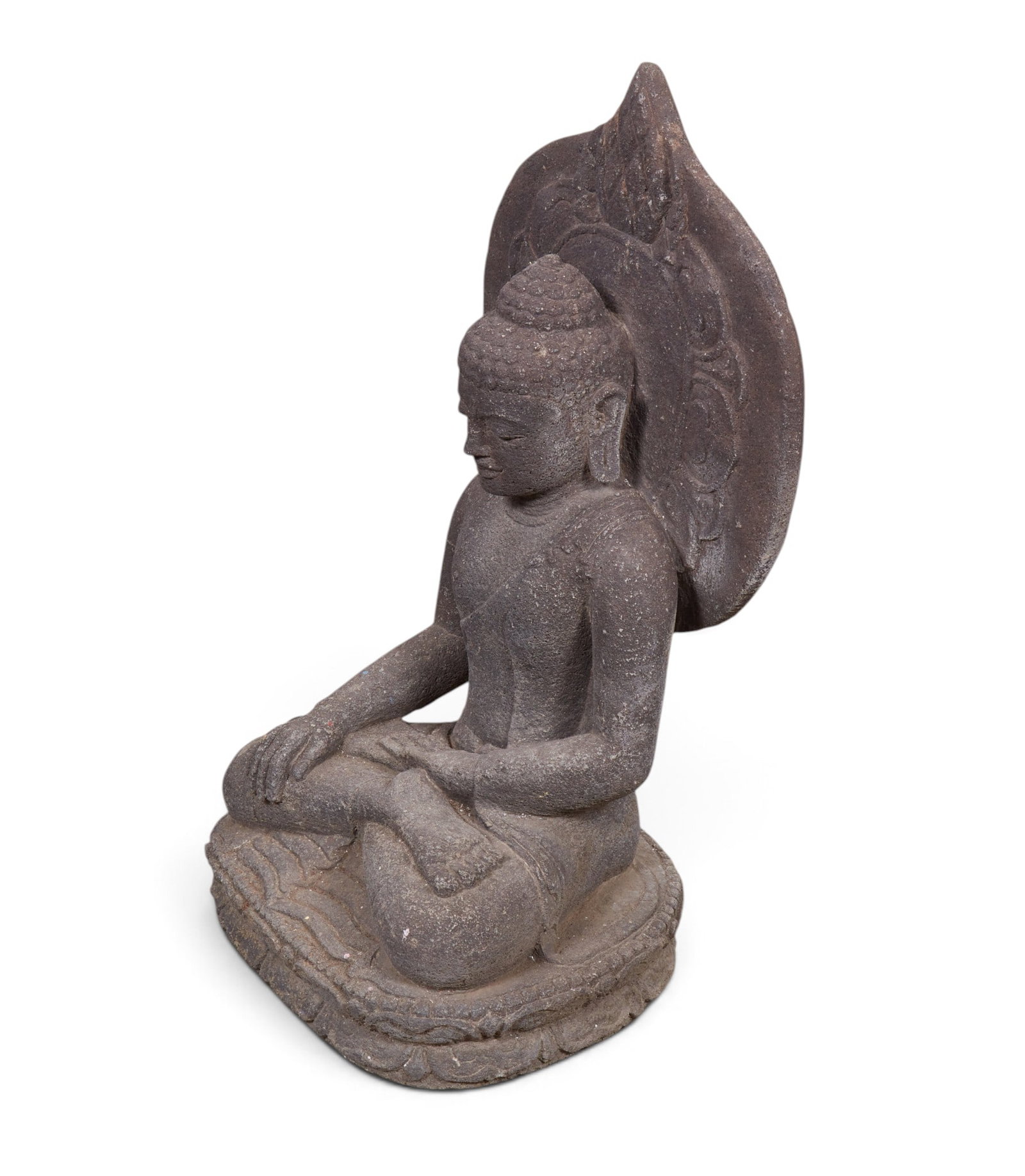 A carved stone figure of seated buddha: A carved stone figure of seated buddha height 28 x width 16 x depth 12 in. (71.1 x 40.6 x 30.5 cm.)