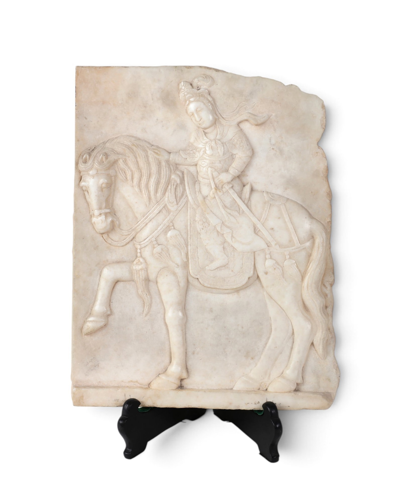 A Chinese carved marble relief fragment of a horse and rider: A Chinese carved marble relief fragment of a horse and rider height of fragment 15 3/4in (40cm); width 12 1/2in (32cm); depth 1 1/4in (3cm) Provenance: Property from a Private Los Angeles Collection.