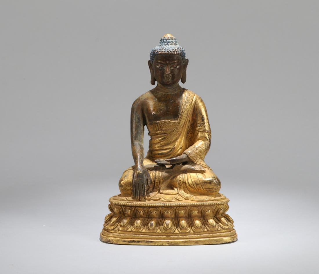 A CHINESE GILT BRONZE FIGURE OF SHAKYAMUNI, QING (1 of 9)