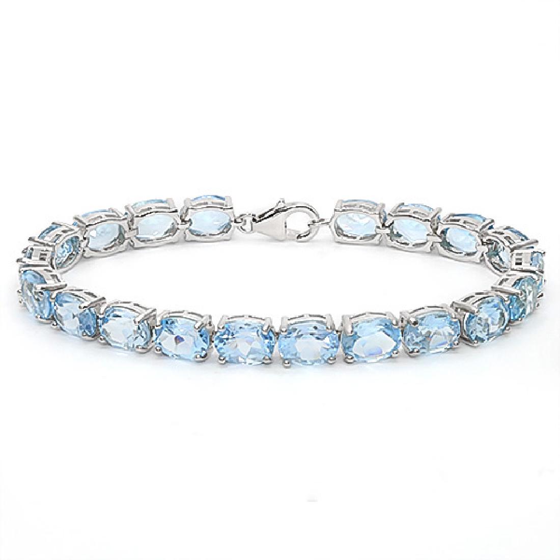 22.45 CT SKY BLUE TOPAZ 925 STERLING SILVER TENNIS BRAC: 22.45 CT SKY BLUE TOPAZ 925 STERLING SILVER TENNIS BRACELET IN OVAL SHAPE **|**|** 22.45 CT SKY BLUE TOPAZ 925 STERLING SILVER TENNIS BRACELET IN OVAL SHAPE #1AC50067