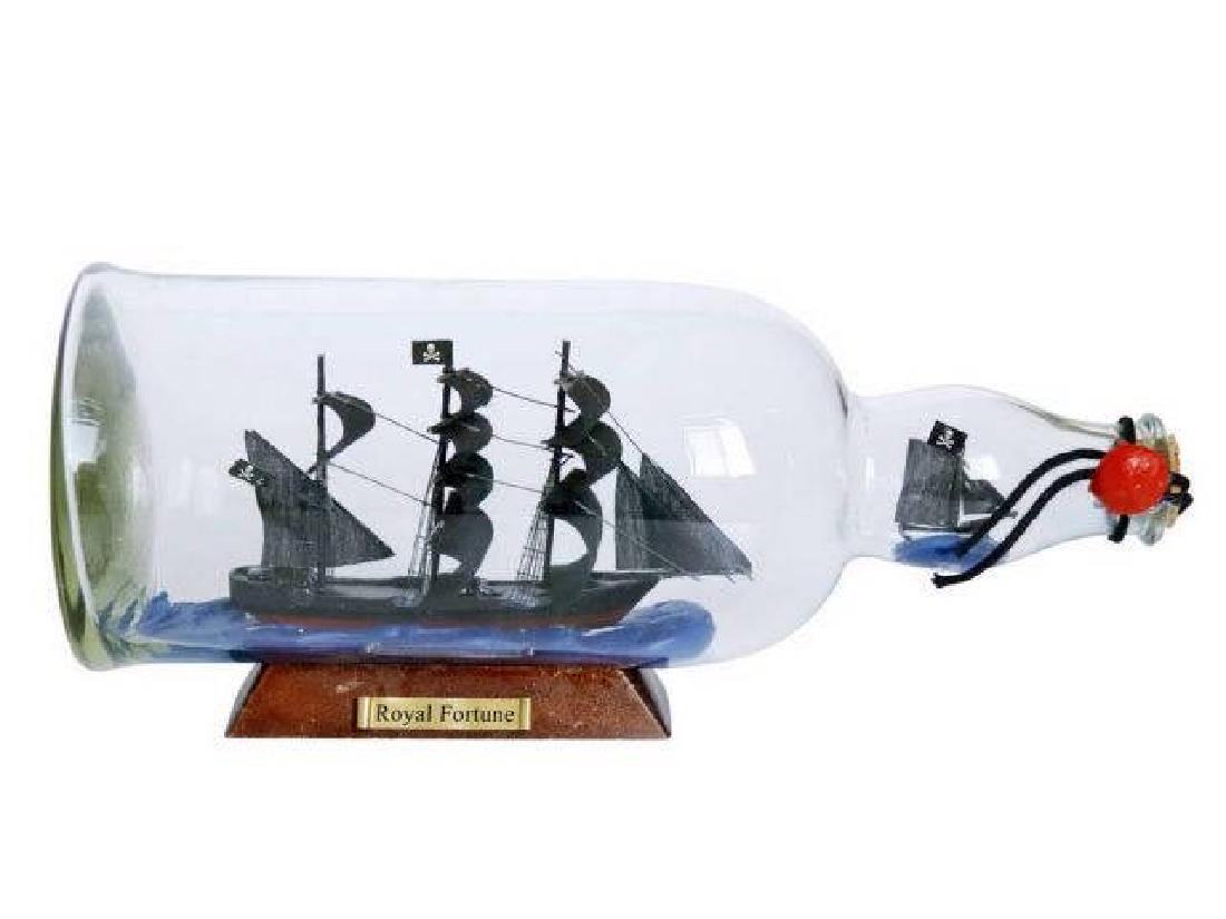 Black Barts Royal Fortune Model Ship in a Glass Bottle: Black Barts Royal Fortune Model Ship in a Glass Bottle 11in. **|**|** Set sail and take on the high seas with this beautiful replica of Captain Black Barts?Royal Fortune?pirate ship. This item will sh