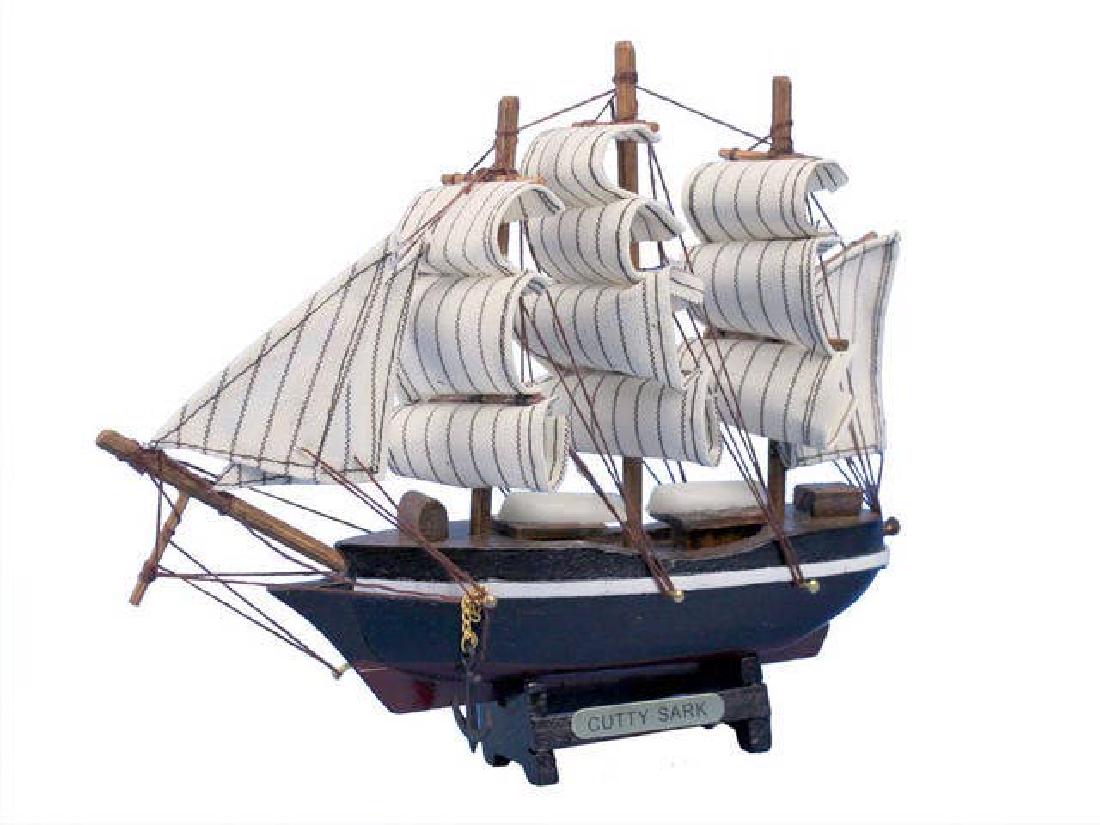 Wooden Cutty Sark Tall Model Clipper Ship 7in.: Wooden Cutty Sark Tall Model Clipper Ship 7in. **|**|** Built to be one of the fastest ships on the sea in order to command the tea trade between England and China the legendary Cutty Sark is brought 