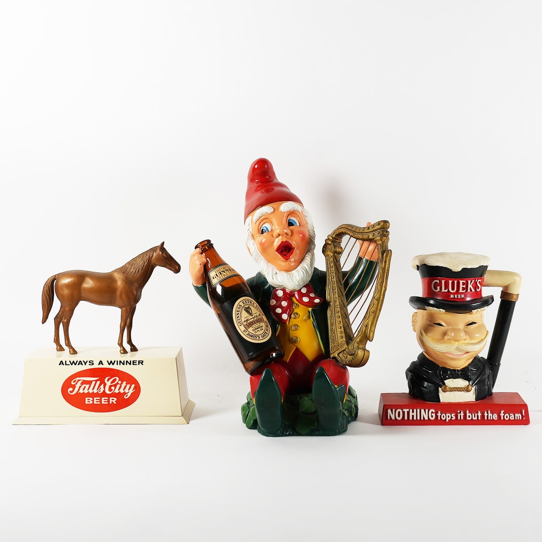 Falls City Guiness and Glueks Back Bar Statues LOT OF 3: Three vintage beer advertising figures or back bar statues. Includes a Falls City Beer horse, a Guinness gnome with harp, and a Glueck's Beer figure. Some wear consistent with age. Fall City