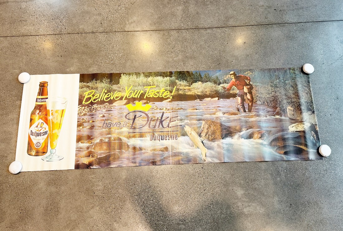 Duquesne Salmon Trout Fly Fishing Large Advertising Sign: Duquesne Brewing. Pittsburgh, Pennsylvania. Rolled paper laminated corrugated cardboard sign. Great fly-fishing scene. About 95 x 32 inches.