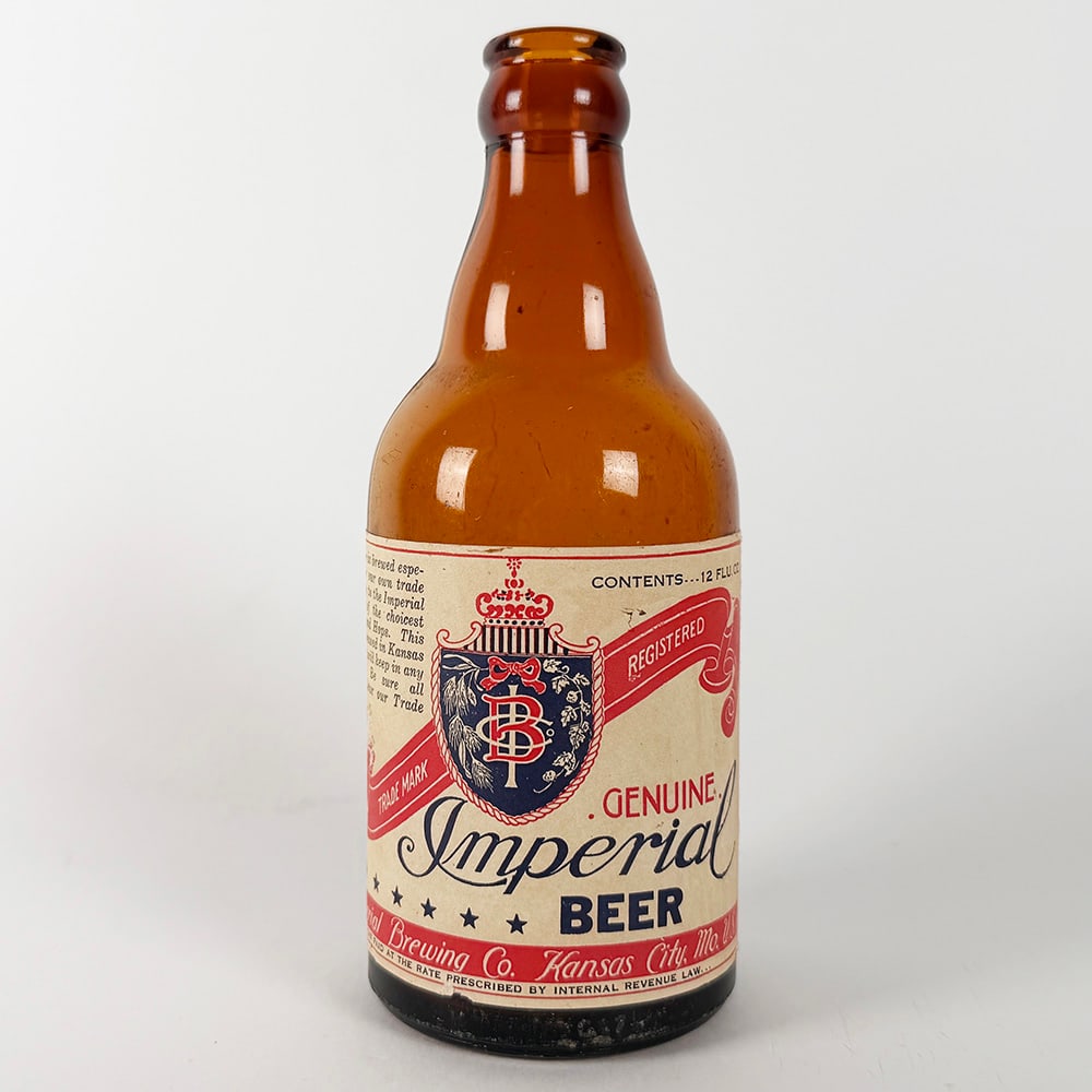 Imperial Brewing Beer Steinie Bottle Kansas City MO: Circa 1940s Imperial Beer steinie bottle from Imperial Brewing Co., Kansas City, Missouri. 12 fl. oz. Features the company's shield.