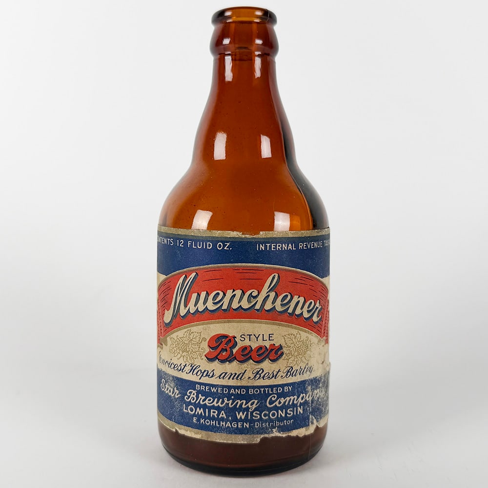 Muenchener Style Beer Steinie Bottle - Star Brewing Lomira WI: Circa 1940s Muenchener Style Beer steinie bottle from Star Brewing Company, Lomira, Wisconsin. Features a red, white and blue label with gold accents. Marked 'Contents 12 Fluid Oz.' and &