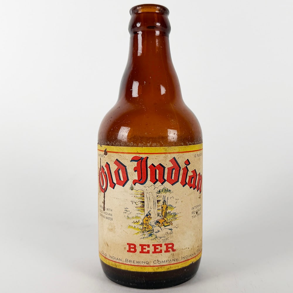 Old Indian Brewing Beer Steinie Bottle Native American Indiana PA: Circa 1950s Old Indian Beer steinie bottle from the Old Indian Brewing Company, Indiana, Pennsylvania. Features a paper label with Native American imagery. 12 fl. oz.