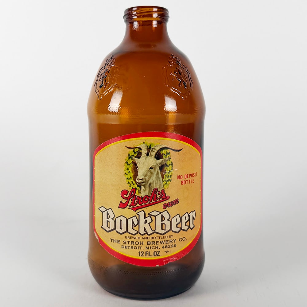 Stroh's Own Bock Beer Stubby Bottle Detroit MI: Circa 1960s Stroh's Own Bock Beer stubby embossed paper label bottle. Features a goat graphic on the label. Marked 'No Deposit Bottle' and 'Brewed and Bottled by The Stroh Brewery Co.,