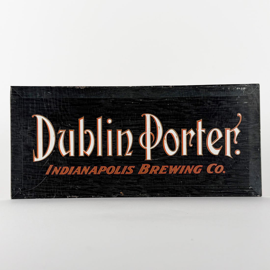 Dublin Porter Indianapolis Brewing TOC Sign: Dublin Porter Indianapolis Brewing Co. tin over cardboard sign. Indiana. Features black background with red and white lettering. Pre-Prohibition. 13 x 6 inches.