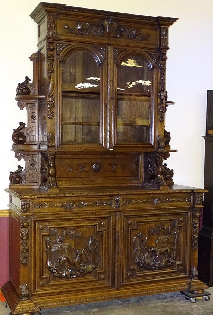 Monumentally Carved Oak Sideboard: Carved oak sidebaord that has winged lions fruit and game carvings with etagere sides in a nice original finish.